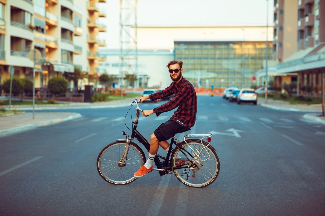 stylish-man-sunglasses-riding-bike-city-street